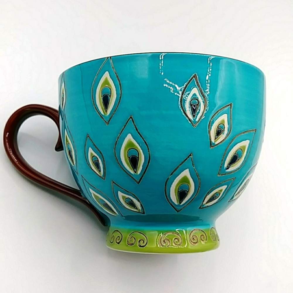 Pier 1 Beautiful Peacock Feather Decorated Mug.